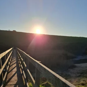 photo of bridge looking towards the sun