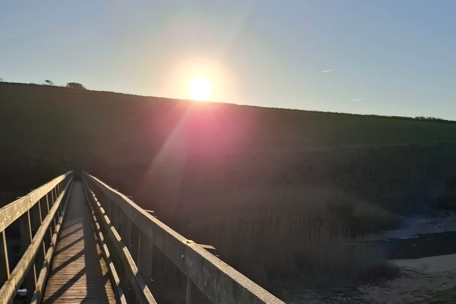 photo of bridge looking towards the sun